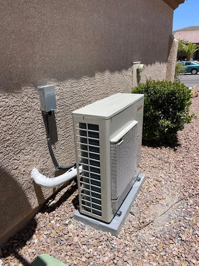 Residential air conditioning condenser unit in Raisin